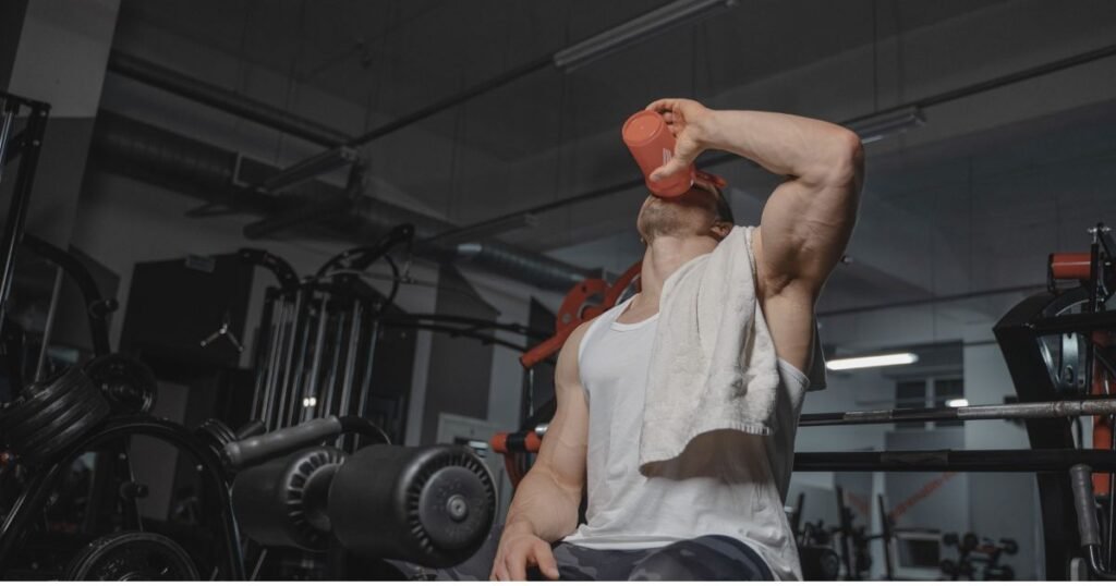 This image shows that the man is watering in gym